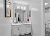 Thumbnail 8 of 18 - Updated apartment bathroom with modern vanity at Southwinds Point Apartments in Henry County.