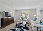 Thumbnail 5 of 18 - Open-concept living room with natural light at Southwinds Point Apartments near I-75 in Stockbridge, GA.