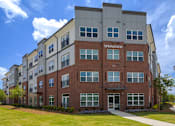Thumbnail 22 of 23 - Exterior view of Springview Apartments in Decatur, GA featuring modern pet-friendly 1, 2 and 3 bedroom apartment homes near Panthersville Road.
