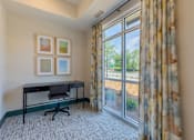 Thumbnail 18 of 23 - Resident office space with large windows and natural light at Springview Apartments in Decatur near I-20.