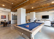 Thumbnail 11 of 23 - Modern resident lounge with billiards, seating areas and entertainment space at Springview Apartments Decatur GA.