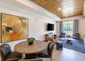 Thumbnail 13 of 23 - Open resident clubhouse with lounge seating and community gathering spaces at Springview Apartments in Decatur, GA.