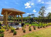 Thumbnail 9 of 23 - Outdoor pavilion and landscaped gathering area at Springview Apartments, a pet-friendly apartment community in Decatur, GA.
