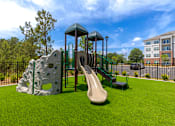 Thumbnail 4 of 23 - Community playground for residents at Springview Apartments offering spacious 1, 2 and 3 bedroom apartments in Decatur, GA.