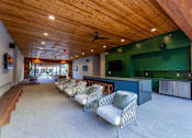 Thumbnail 23 of 28 - Studios in Old East Dallas, TX - 4600 Ross - Lounge with a Community Kitchen, Various Cozy Seating Options, and Multiple TVs