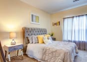 Thumbnail 6 of 27 - Villas at Hannover Apartments in Stockbridge, GA photo of bedroom with plush carpeting and natural light