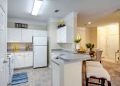 Thumbnail 2 of 27 - Villas at Hannover Apartments in Stockbridge, GA photo of kitchen with white cabinets