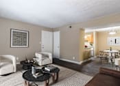 Thumbnail 14 of 29 - Spacious living room with natural light and comfortable seating in a pet-friendly home at Stratford Ridge Apartments in Marietta, GA.