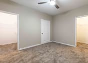Thumbnail 7 of 20 - Sugar Mill Apartments in Addis, LA photo of an empty bedroom with a door to a closet