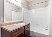 Thumbnail 9 of 20 - Sugar Mill Apartments in Addis, LA photo of a bathroom with a sink and a shower and a mirror