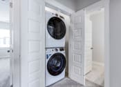 Thumbnail 17 of 25 - Charleston, SC Apartments- Sumner Village - Laundry Room with Stackable In-Unit Washer and Dryer