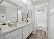 Thumbnail 8 of 21 - Bathroom with ink vanity at Sunnyside Senior Apartments San Dimas CA