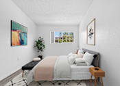 Thumbnail 13 of 21 - Cozy bedroom with soft tones at Sunnyside Senior Apartments 1 bedroom for rent