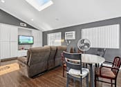 Thumbnail 18 of 21 - Comfortable community room for social gatherings and activities at Sunnyside Senior Apartments in San Dimas, CA
