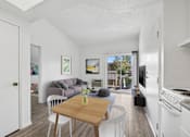 Thumbnail 12 of 21 - Open living area with modern flooring at Sunnyside Senior Apartments in San Dimas CA