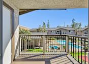 Thumbnail 10 of 21 - Private patio or balcony with peaceful community view at Sunnyside Senior Apartments in San Dimas, California