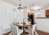Thumbnail 5 of 32 - Open-concept dining area next to the kitchen at Tattersall Village Apartments near Richmond Hill, GA