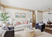 Thumbnail 8 of 32 - Comfortable and pet-friendly living room with neutral decor at Tattersall Village Apartments in Hinesville, Georgia