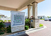 Thumbnail 55 of 55 - A sign for The Crofton is displayed in front of a building.