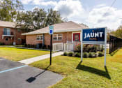 Thumbnail 20 of 20 - The Jaunt Apartments in Charleston South Carolina photo of exterior of leasing office with The Jaunt signage in front.