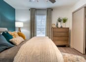 Thumbnail 7 of 20 - The Jaunt Apartments in Charleston South Carolina photo of bedroom with plush carpeting and a ceiling fan