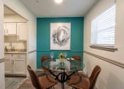 Thumbnail 3 of 20 - The Jaunt Apartments in Charleston South Carolina photo of a dining room area with table and painting