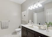 Thumbnail 8 of 29 - bathroom with dark wood vanity
