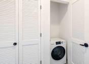 Thumbnail 19 of 27 - a washer and dryer in a closet in a laundry room