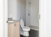 Thumbnail 23 of 27 - an empty bathroom with a toilet and a shower