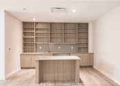 Thumbnail 24 of 27 - a kitchen with wooden shelves and a counter top in a new home