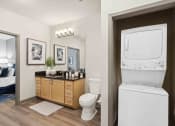 Thumbnail 7 of 29 - Sage at 1240 apartments in Mount Pleasant South Carolina photo of bathroom with stackable washer and dryer