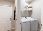 Thumbnail 8 of 32 - In-unit washer and dryer set in a modern laundry area at The Sanctuary at 331 in Santa Rosa Beach, FL