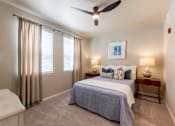 Thumbnail 7 of 32 - Cozy bedroom featuring a ceiling fan and large windows at The Sanctuary at 331 in Santa Rosa Beach, FL