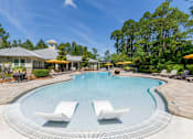 Thumbnail 2 of 32 - Resort-style swimming pool with lounge seatin at The Sanctuary at 331 in Santa Rosa Beach, FL