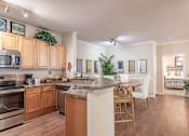 Thumbnail 1 of 24 - •	Opelika, AL Apartments – The Crossings of Opelika - a kitchen and dining area