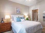 Thumbnail 9 of 24 - Apartments in Opelika for Rent – The Crossings of Opelika - bedroom with plush carpeting and ceiling fan