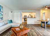 Thumbnail 4 of 11 - a living room with a couch and a coffee table