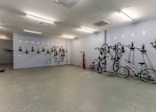 Thumbnail 26 of 39 - A bike parking room with 18 bikes.