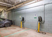 Thumbnail 25 of 39 - A charging station for electric vehicles is located in a parking garage.
