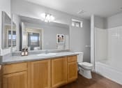 Thumbnail 6 of 19 - a bathroom with a sink toilet and a shower
