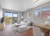 Thumbnail 3 of 19 - Dog-Friendly Apartments in Petaluma, CA - Theatre Square - Spacious Living Room With Wood-Plank Flooring, Windows, High Ceiling, And A Balcony With Views Of The Neighborhood