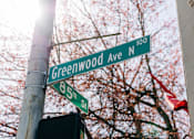 Thumbnail 15 of 15 - a street sign on the corner of greenwood avenue and 85th street