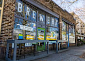 Thumbnail 11 of 15 - a storefront with a sign that reads brewery