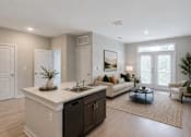 Thumbnail 5 of 17 - Professionally staged open-concept living room at Townes at Clarkston Centre, a pet-friendly apartment community in Clarkston, GA near Decatur.
