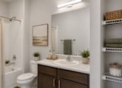 Thumbnail 7 of 17 - Professionally staged bathroom with oversized vanity and linen storage at Townes at Clarkston Centre in Clarkston, GA.