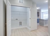 Thumbnail 8 of 17 - Apartment laundry area with washer and dryer connections at Townes at Clarkston Centre in Clarkston, GA.