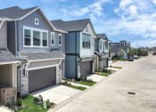Thumbnail 1 of 34 - a row of houses on a street