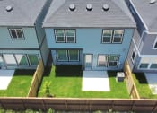 Thumbnail 6 of 34 - a view of the backyard of a house from above