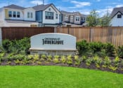 Thumbnail 8 of 34 - a subdivision sign in front of a row of houses