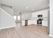 Thumbnail 21 of 39 - the living room and kitchen in a 555 waverly unit